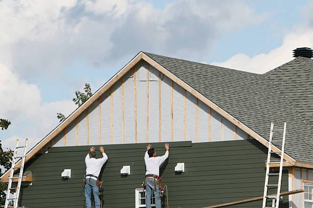 Professional Emergency Siding Repair technician working in Wayland, MA